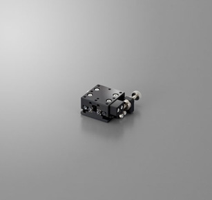 The Suruga Seiki B11-25CRN1 is a manual X axis linear crossed roller feed screw stage with a 25x25mm platform, load capacity of 1.0kgf and travel distance of +/- 3.2 mm. 